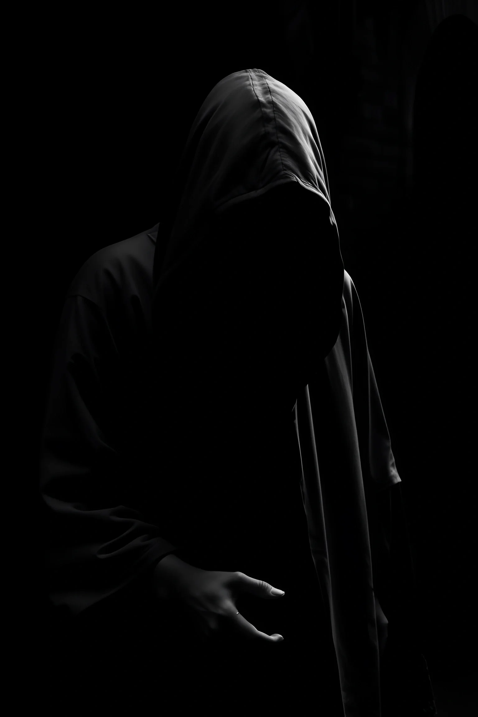 Shadowed Figure in Hooded Garment - Free Download - AI Scribbles