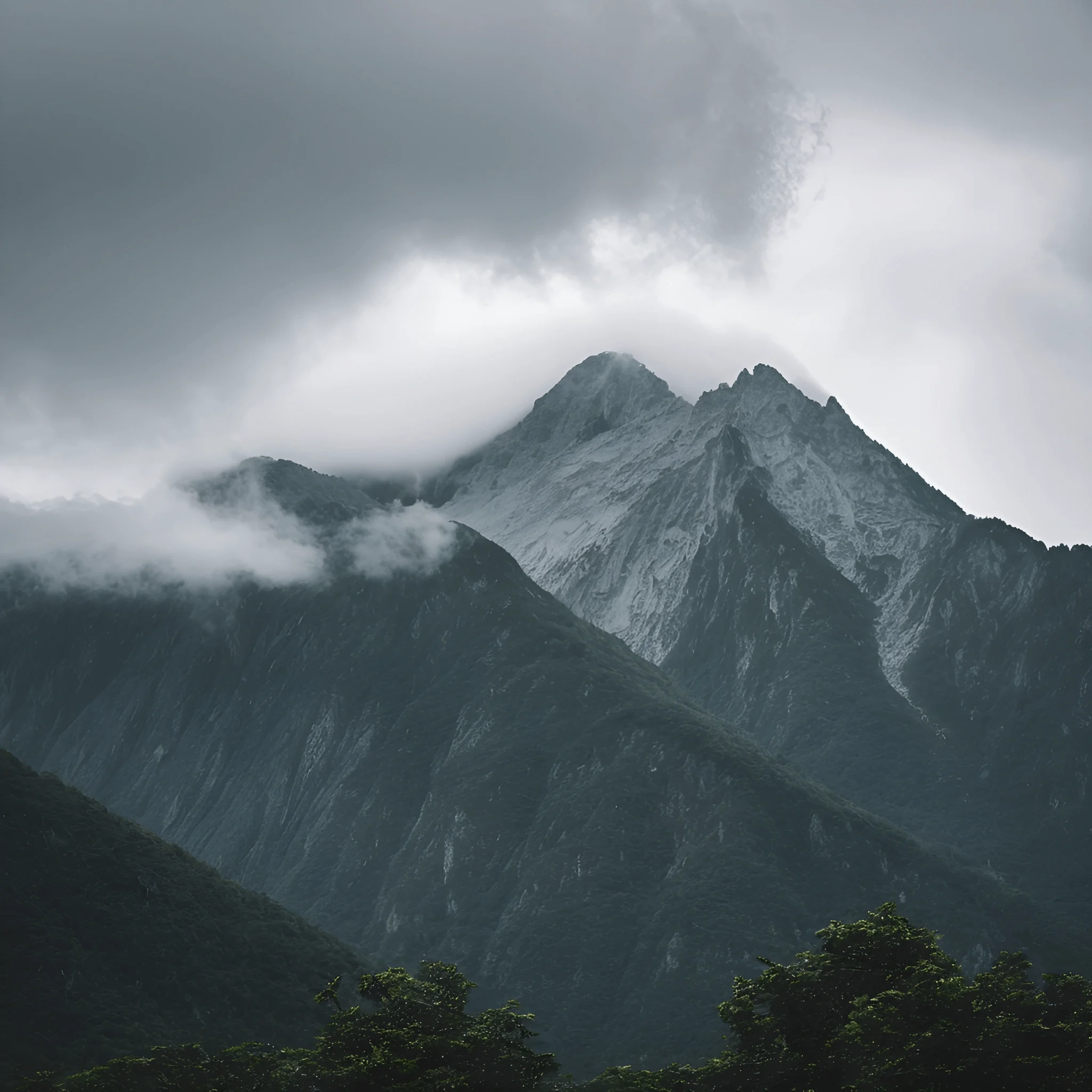 Majestic Mountain Peaks Under Cloudy Skies - Free Download - AI Scribbles